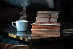 white ceramic mug on brown wooden table